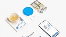 Healthy.io's Minuteful test kit, including a smartphone displaying the app