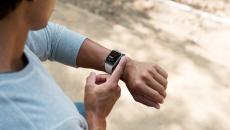 Person taking an ECG reading on an Apple Watch