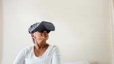 A woman wearing an AppliedVR headset