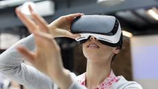 Woman looking into virtual reality glasses