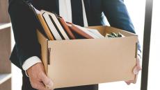 Businessperson carrying a box 