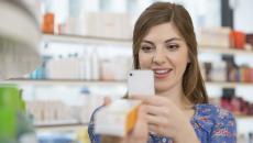 Person taking a picture of a medication box