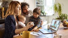 A family consulting with their doctor virtually