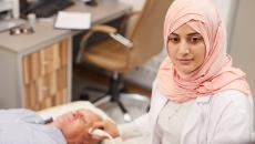 Technician performing an ultrasound exam