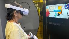 A nurse trying out a VR simulator at the Virtual Reality Health Lab in KD Hospital