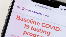 A phone showing a screenshot from Project Baseline's COVID-19 testing program.