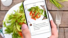 Yes Health user taking a picture of their salad lunch to share with their health coach