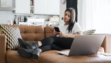 Distracted patient uses phone during a telehealth visit.