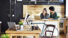 Two workers at a desk