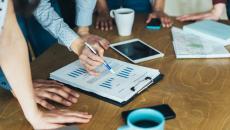 A close up of a team looking at financial information