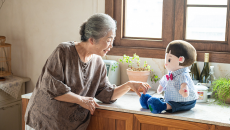 A senior individual interacting with an AI companion doll