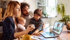 A family talking to a doctor on a laptop