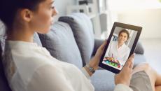 Patient using telehealth to talk to a healthcare professional on a tablet