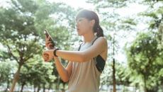 A person checking their fitness tracker data on their mobile phone