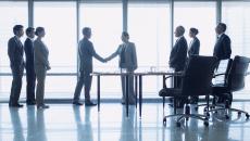 Group of business people shaking hands.