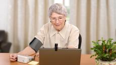 An older woman using telemedicine.