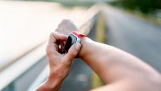 A close up of a person wearing a smartwatch