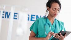 Healthcare provider looking at a tablet