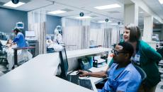 Healthcare providers sitting in a hospital setting