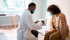 A woman talking to her doctor