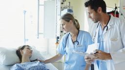 Healthcare professionals consulting with a patient