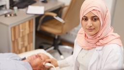 Technician performing an ultrasound exam