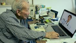 Person consulting with physician via laptop