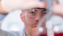 Scientist working with chemicals in a lab