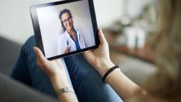 Person speaking to healthcare provider on a tablet