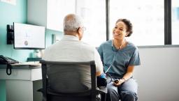 Healthcare provider talking in a patient in a clinical setting