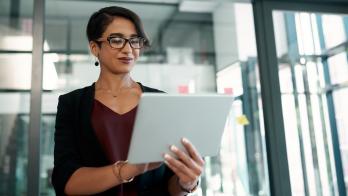 Person reviewing data on a laptop