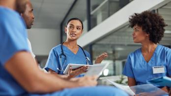 Healthcare providers sitting in a circle