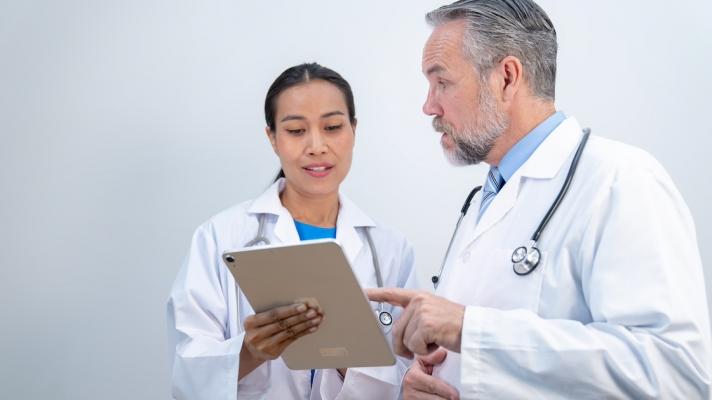 Clinicians reviewing patient record