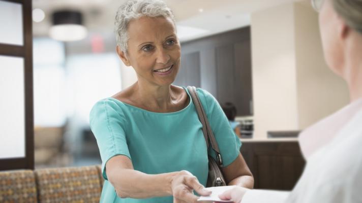 Patient discussing prescription with healthcare professional 