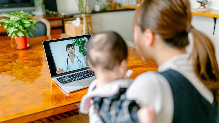 Patient and child attending telehealth appointment