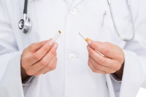 Doctor breaking cigarette