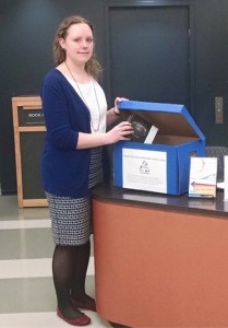 Katherine Morley makes a donation at the Hirsh Library at Tufts.